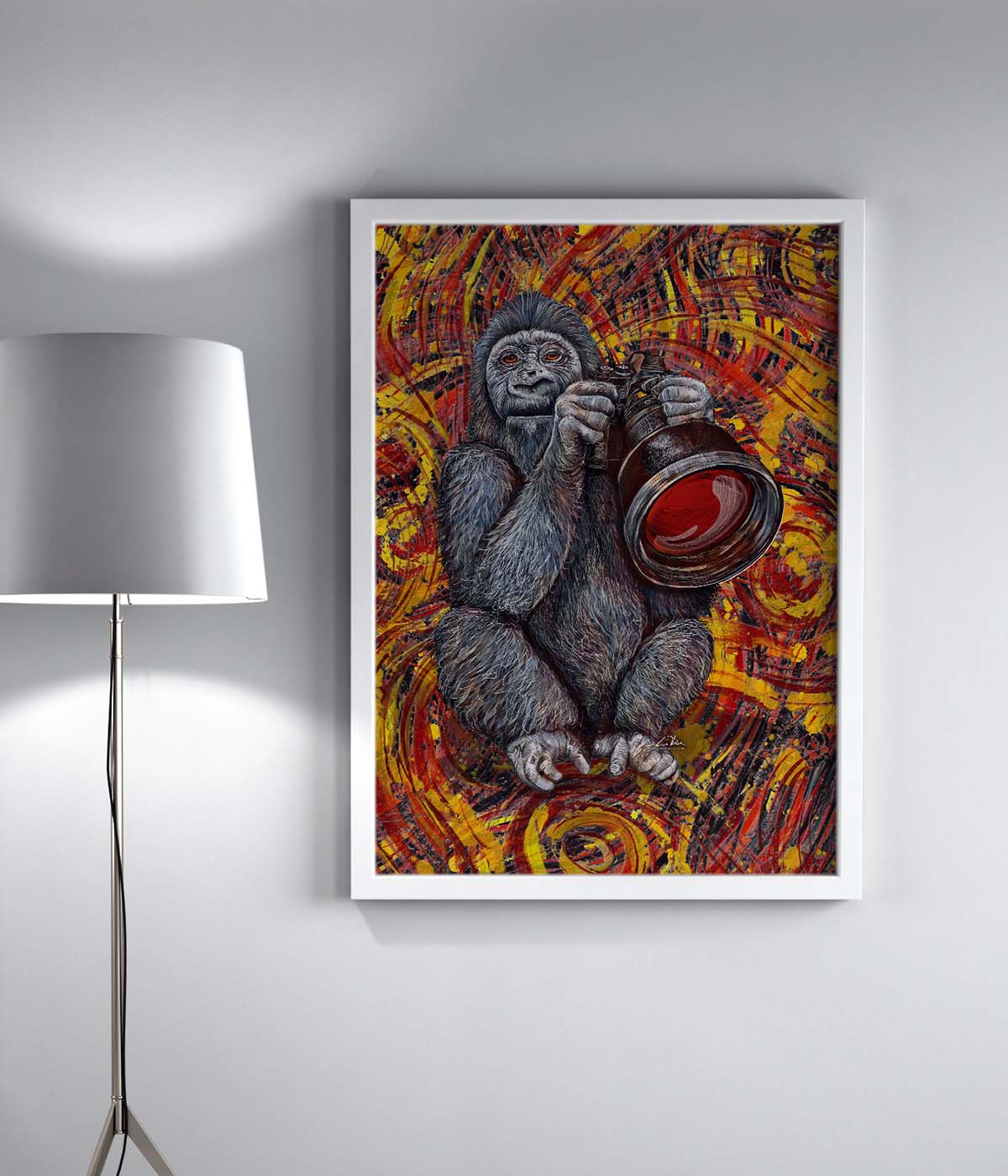 Sports Photographer art by Doug LaRue in a white frame by a lamp
