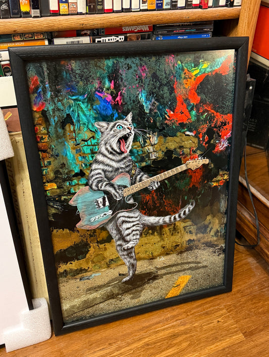 Gato de la guitarra de los músicos callejeros