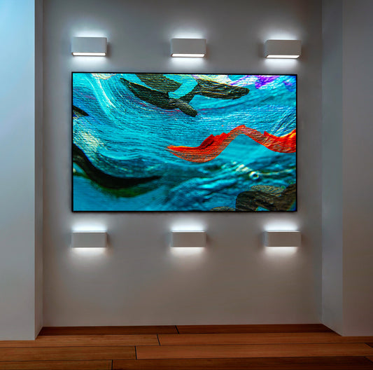 Sea Serpents abstract art by Doug LaRue on a gallery wall with special lighting