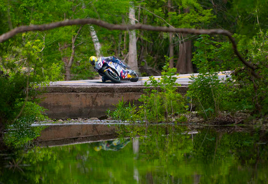 GP Grand Prox Motorcycle on a creek bridge photograph by Doug LaRue