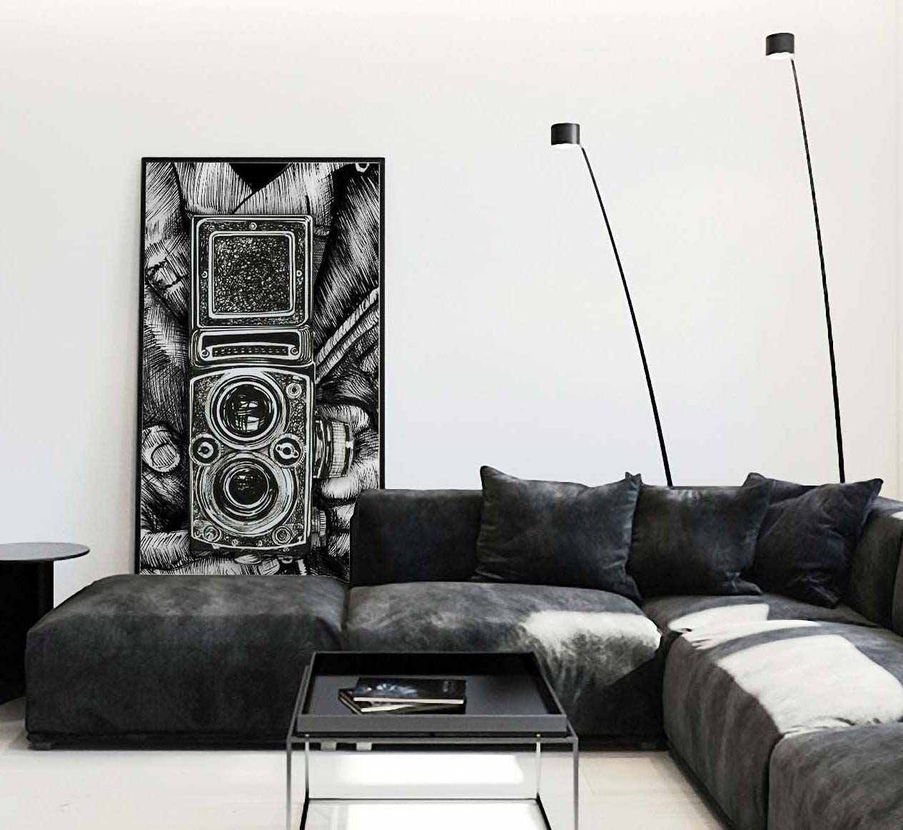 Leather Twin Lens Black and White framed poster leaning on wall behind suede couch