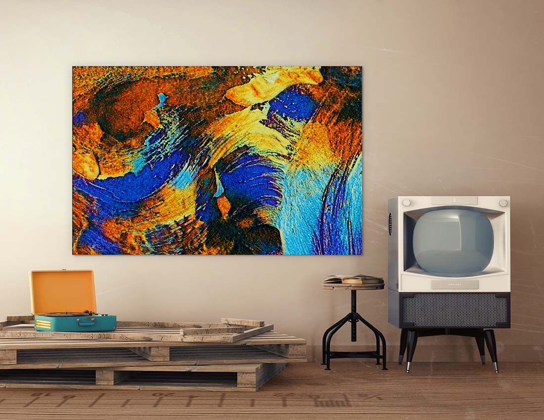 Cobalt mixed media art by Doug LaRue on a beige wall next to an antique television