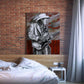 Guitarist Stevie Ray Vaughan mixed media art print on a bedroom brick wall