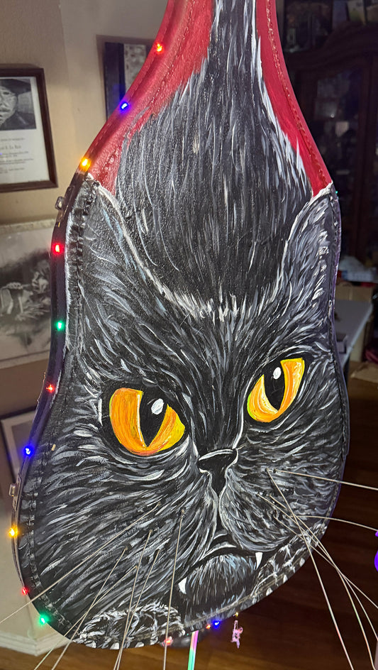 Decorative item with a black cat design on a red background Black Cat Case by Doug LaRue