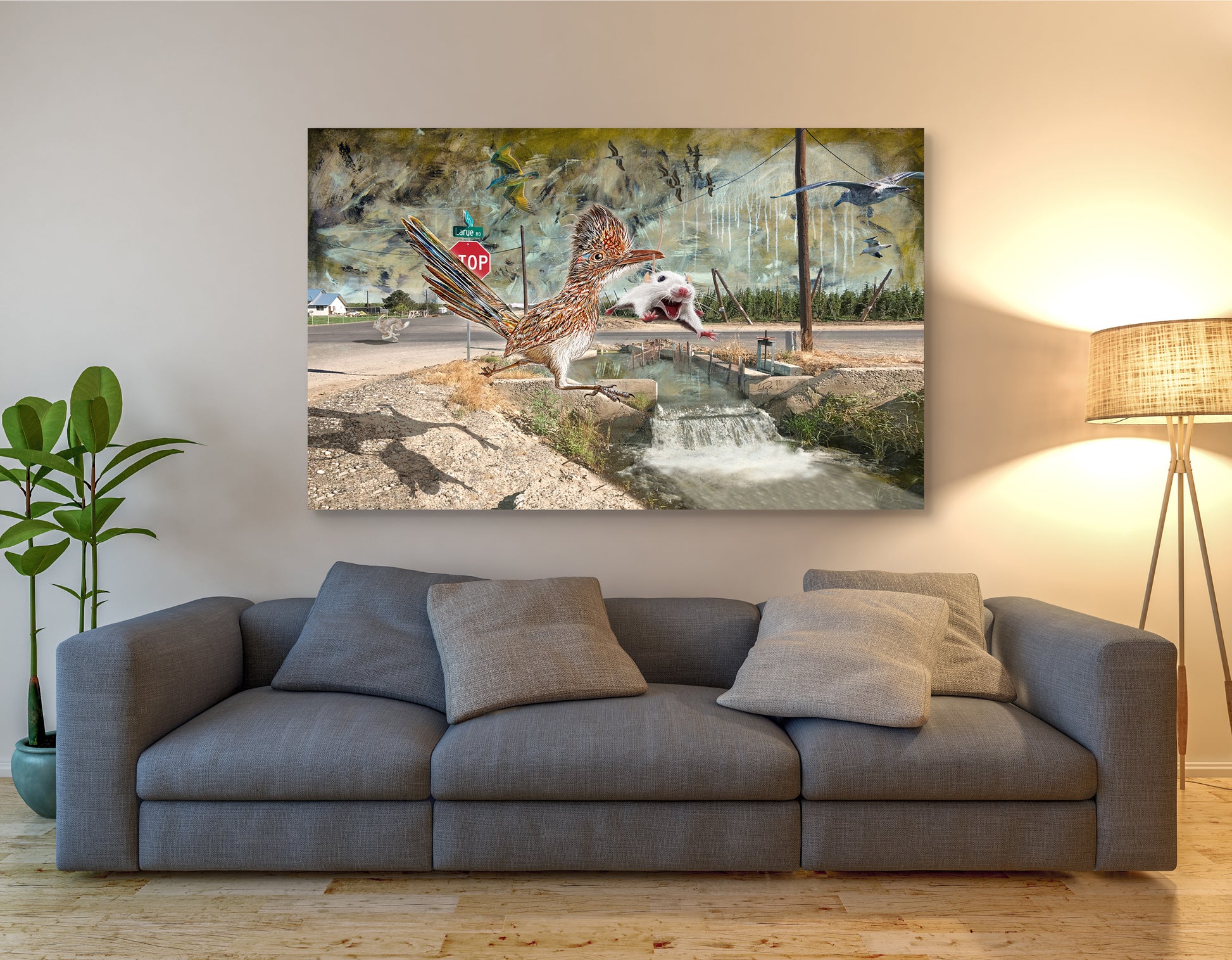 Gray sofa in a living room with a large abstract painting above it. Larue Road Runner by Doug LaRue