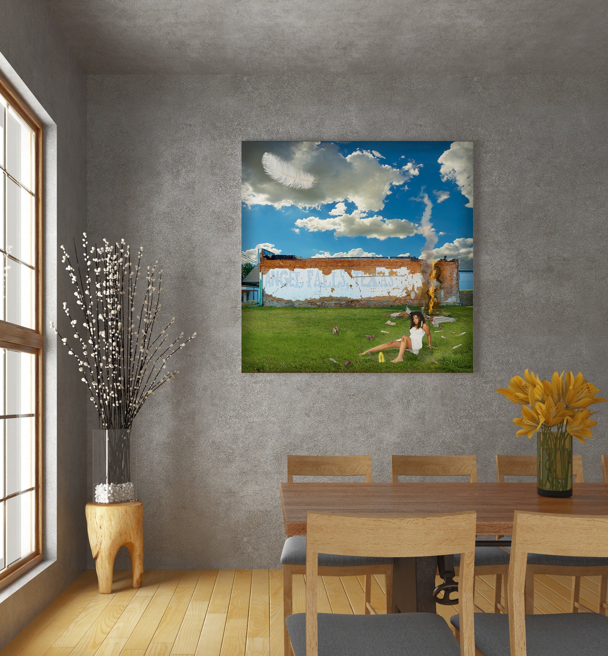 Dining room with a large painting of a woman on grass, a table, chairs, and decorative elements. Angel Falls mixed media art by Doug LaRue 