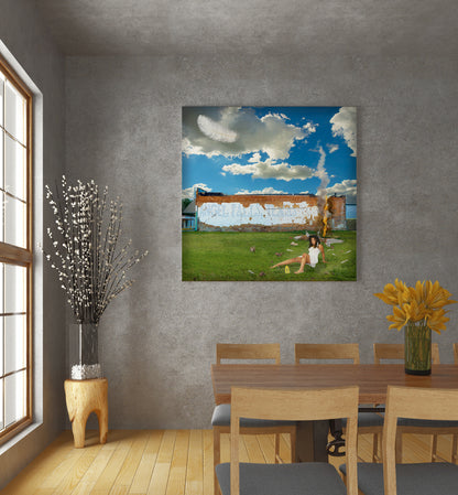 Dining room with a large painting of a woman on grass, a table, chairs, and decorative elements. Angel Falls mixed media art by Doug LaRue 