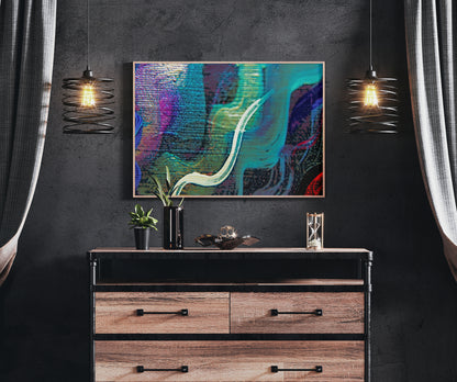 Abstract colorful wall art hanging above a wooden dresser in a dark modern room with two pendant lights and curtains. Lost Creek Feather art by Doug LaRue