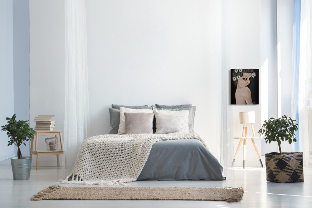 Modern bedroom with a bed, plants, and a lamp. Drews Daisies painting by Doug LaRue