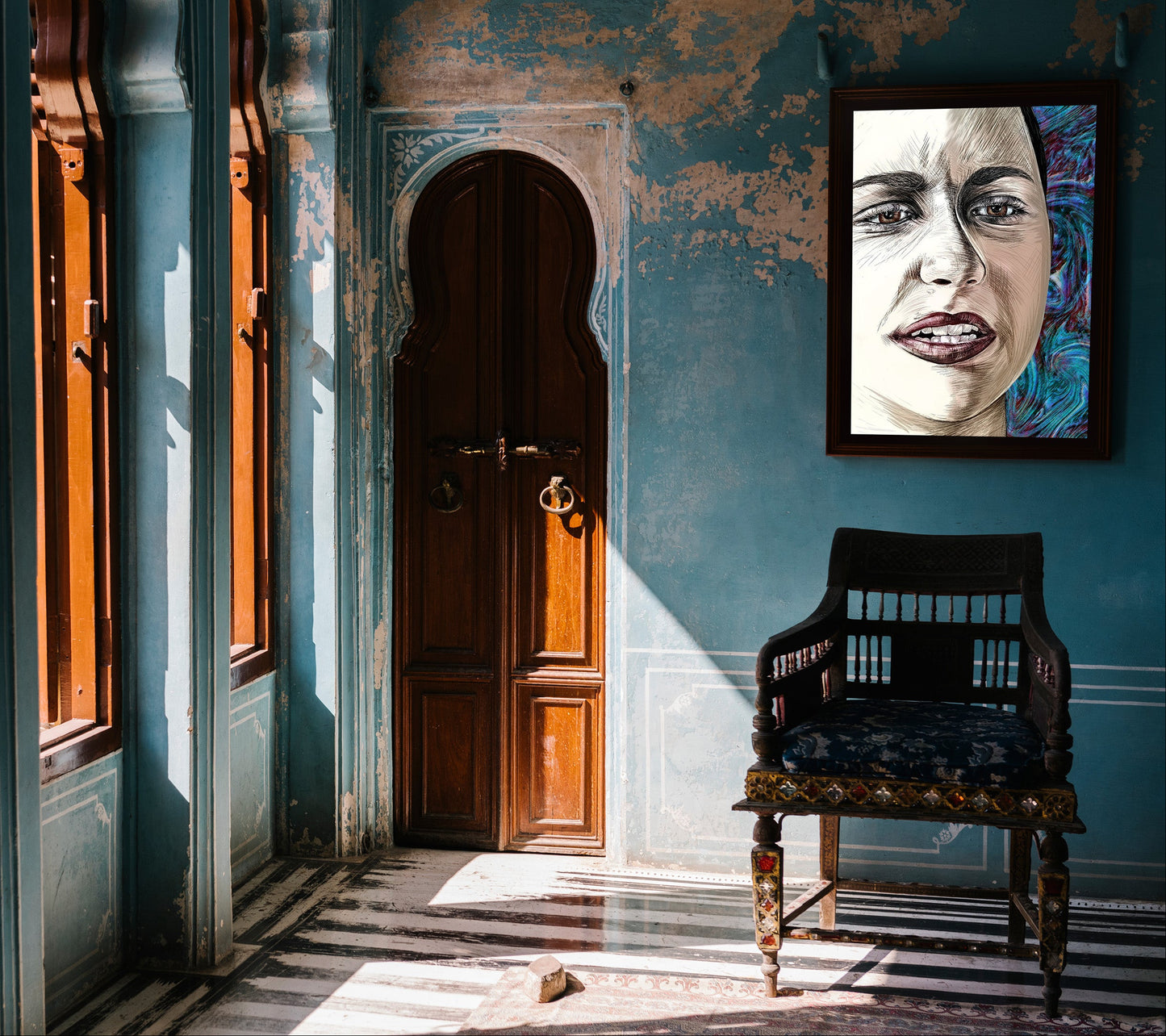 A framed portrait print of a woman's face hangs on a distressed blue wall in an old interior with wooden doors, windows, and a dark wooden chair. Emma Gonzales by Doug LaRue