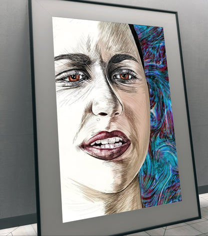 A framed portrait art print leaning against a gray wall in an indoor setting. The artwork shows a close-up of a woman's face with detailed shading and a vivid blue, purple, and teal patterned section on the right side. 