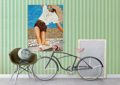 Bicycle leaning against a wall with a framed picture of a woman on a beach.  a colorful abstract oceanside beach path
