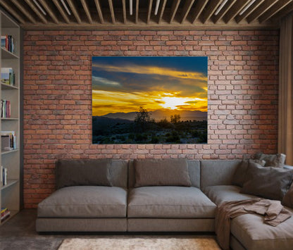 Joshua Tree Sunset by Doug LaRue large print on a brick wall over a couch