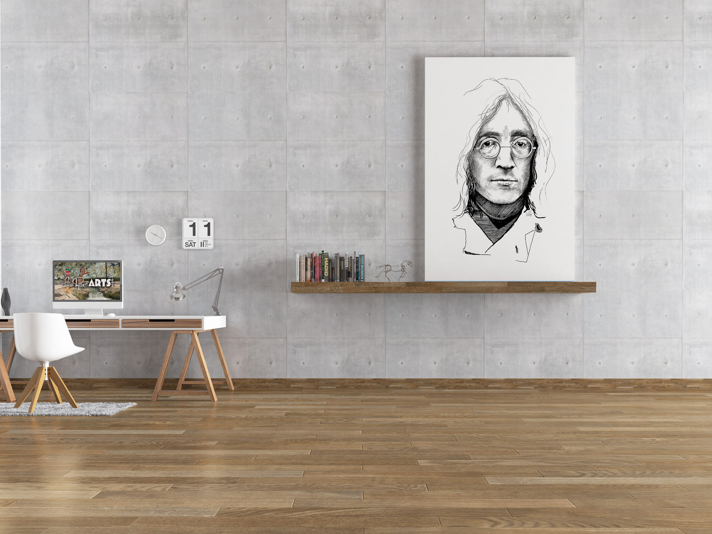 Modern office interior with a desk, books, and a framed portrait on a gray wall. John Lennon sketch by Doug LaRue