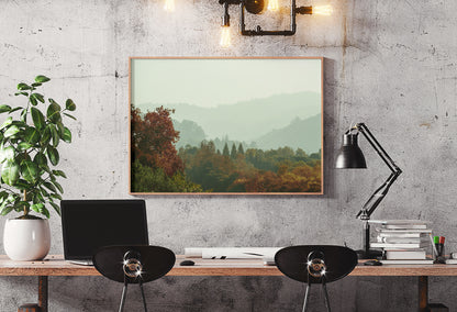 Misty Cali Fog LA photograph by Doug LaRue in a thin wood frame over a desk