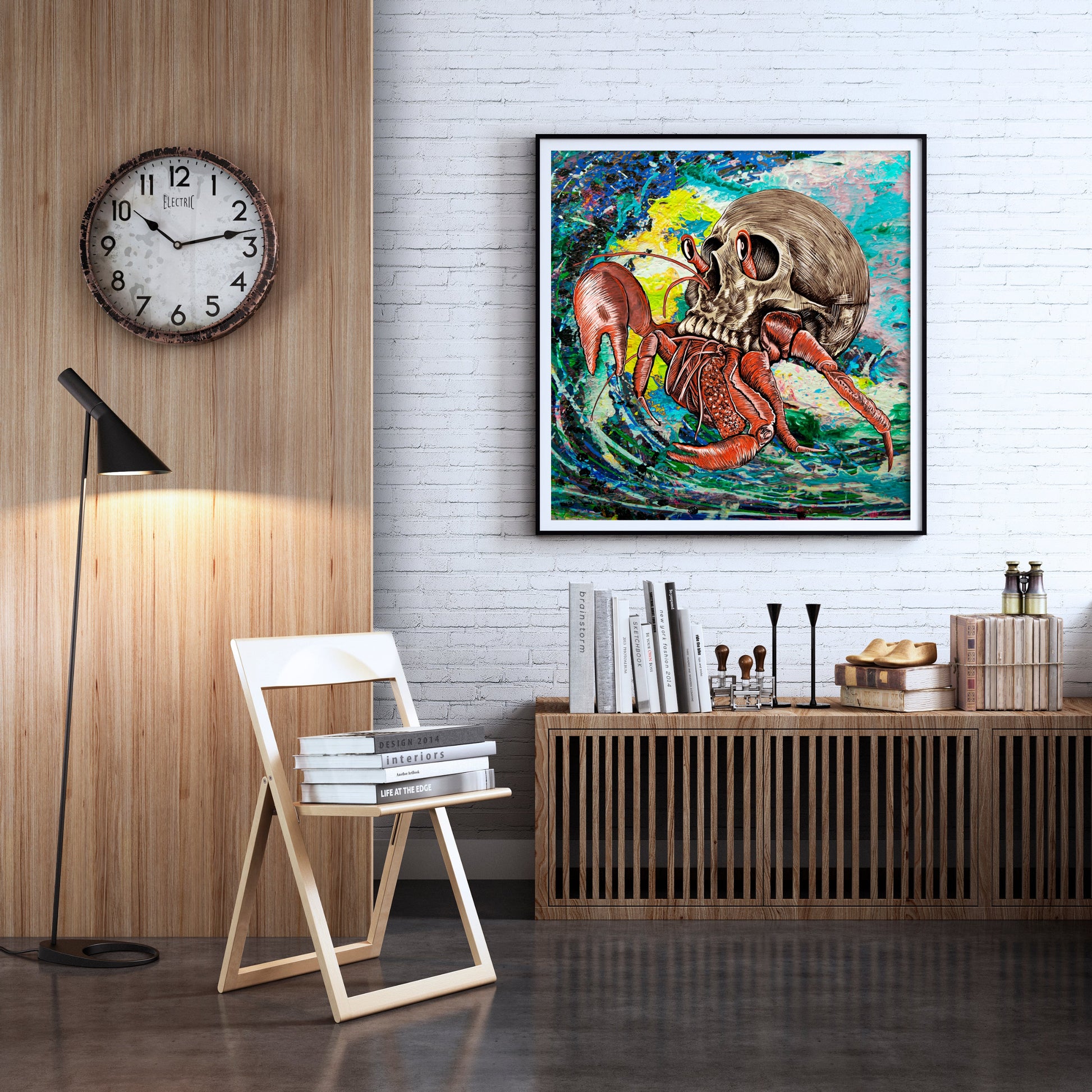 Skull Crab mixed media art by Doug LaRue framed on a white brick wall in a study