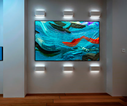 Sea Serpents abstract art by Doug LaRue on a gallery wall with special lighting
