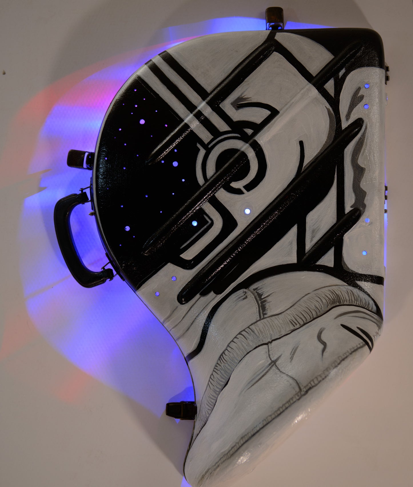 A hand-painted French horn case in the form of an astronauts helmet. Space Helmet
