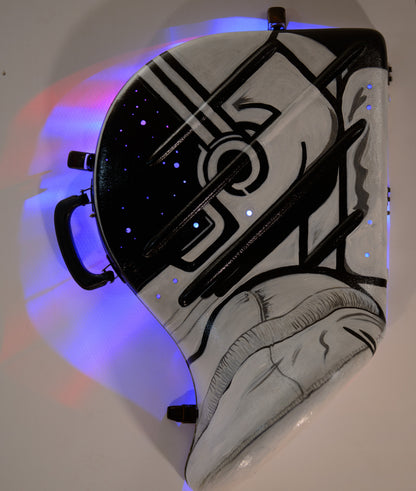 A hand-painted French horn case in the form of an astronauts helmet. Space Helmet