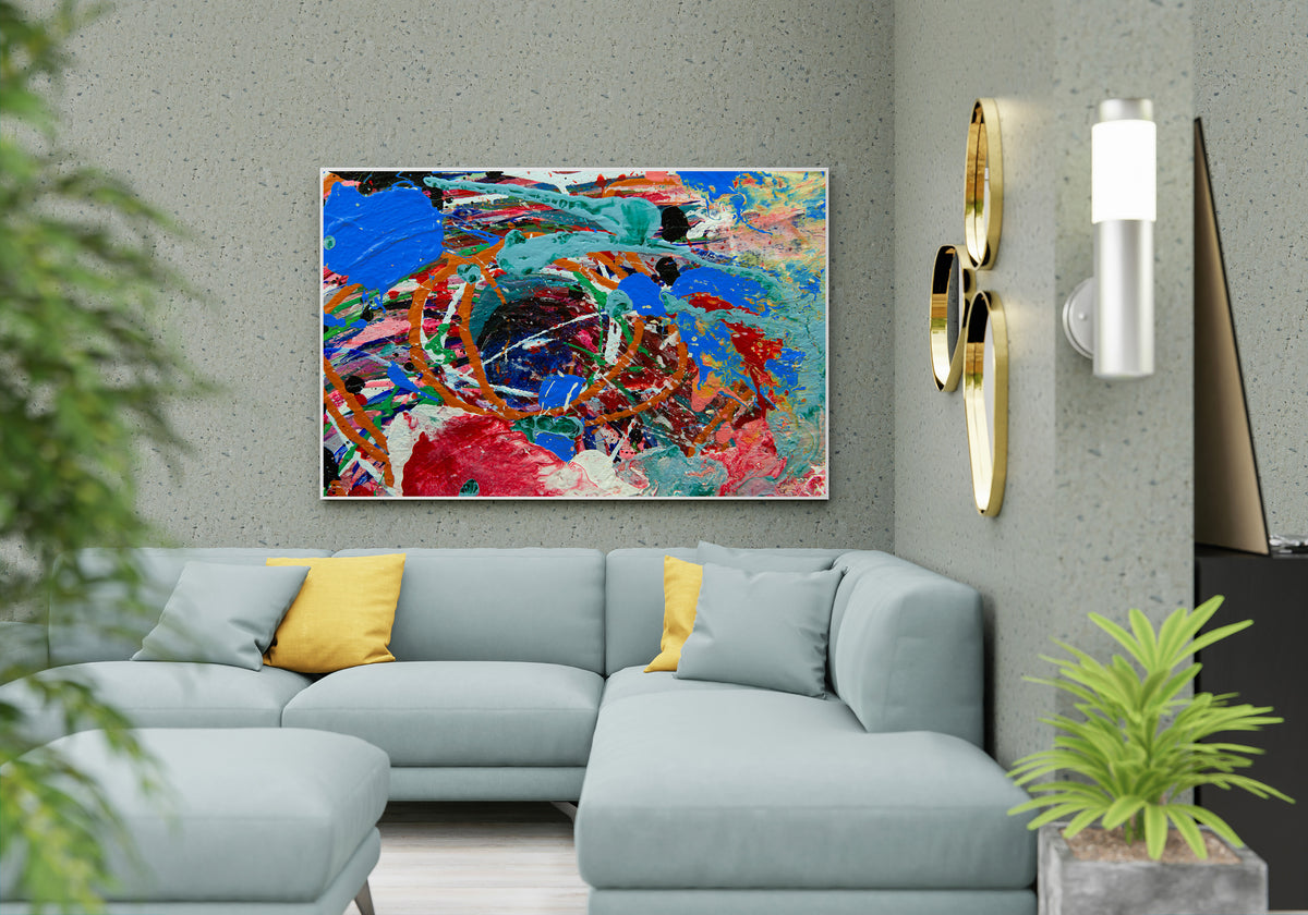 A colorful abstract canvas painting with vibrant blue, red, orange, and green brushstrokes, displayed on a textured gray wall above a modern light blue sectional sofa with yellow accent pillows. Sweetbriar Deep Ellem b y Doug LaRue