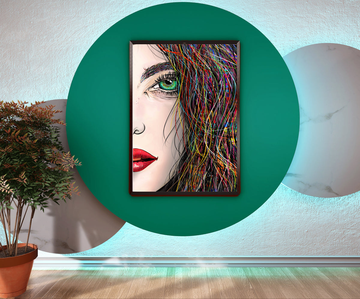 A framed vertical art print featuring a stylized woman's face with colorful hair, displayed on a wall within a large green circular light fixture. The room setting includes a potted plant on the left and a marble-patterned circular light on the right. Tara's Green Eye by our LaRue