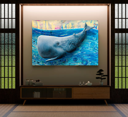 A large canvas wall art print depicting a blue whale swimming in vibrant blue water, displayed in a modern Japanese-style room above a wooden console table. Whale by Doug LaRue