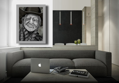 Modern living room with a gray sofa, laptop, and framed portrait of Willie Nelson by Doug LaRue on the wall.
