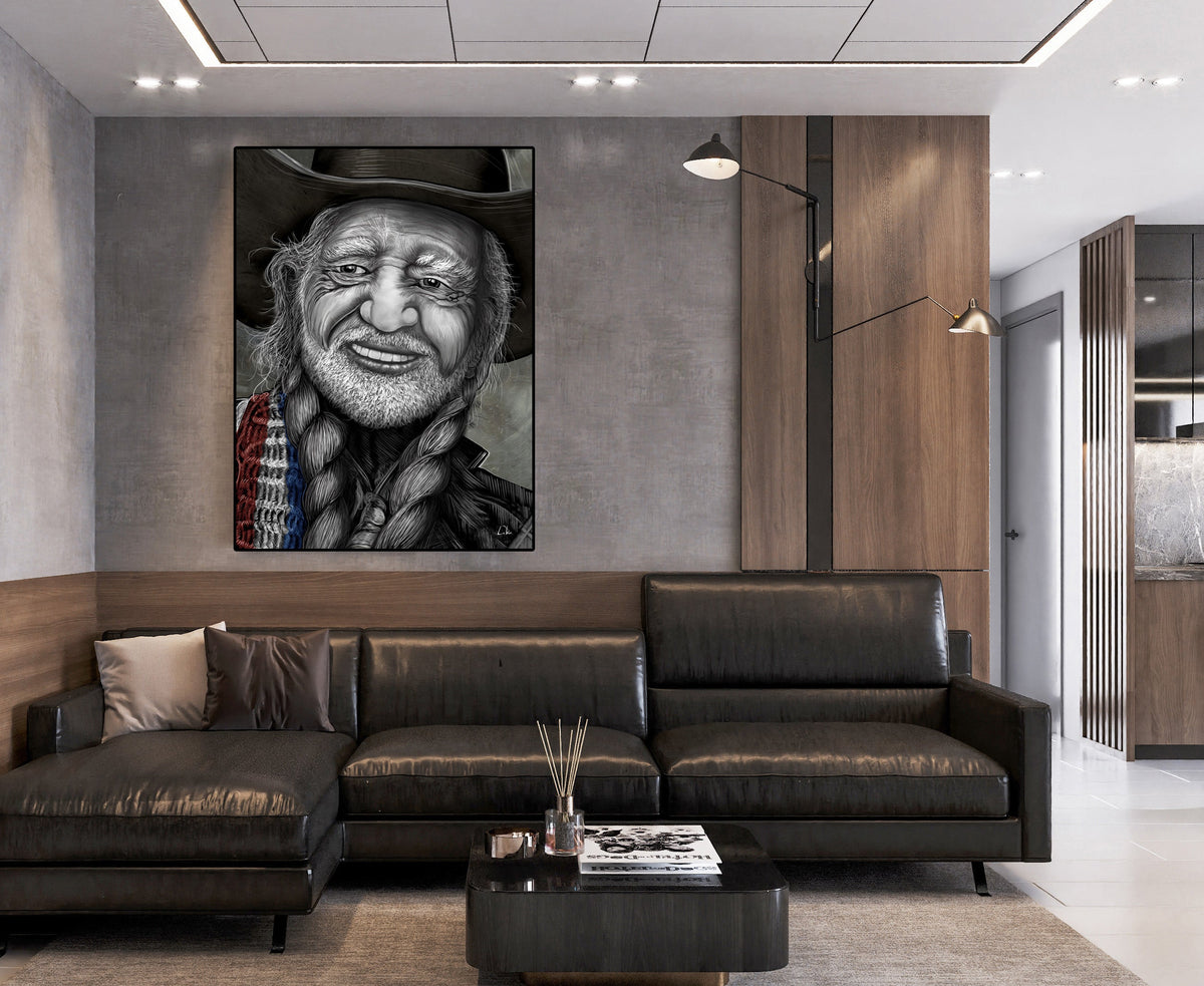 A large black and white portrait canvas print of a bearded man in a hat, displayed on a gray wall above a modern dark leather sectional sofa in a contemporary living room. Willie Nelson by Doug LaRue