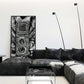 Leather Twin Lens Black and White framed poster leaning on wall behind suede couch