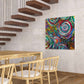Vid-19 Planetary Convergence art print on a tile wall in a dining room near modern stairs