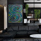 S Abstract painting by Doug LaRue large print on a wall in a living room