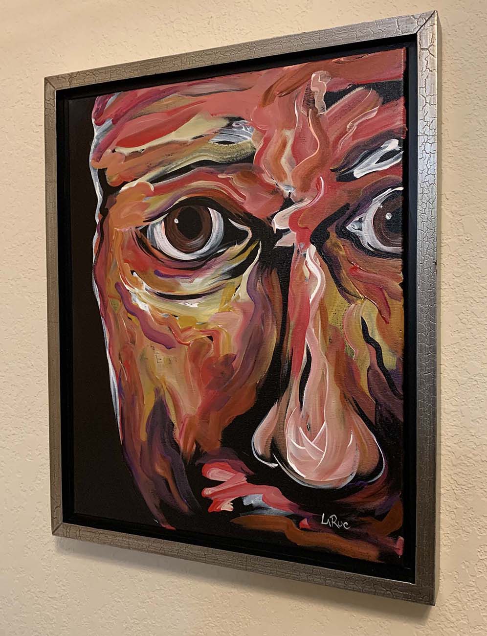 Lawrence is a figurative abstract portrait painting by Doug LaRue in a gold floater frame