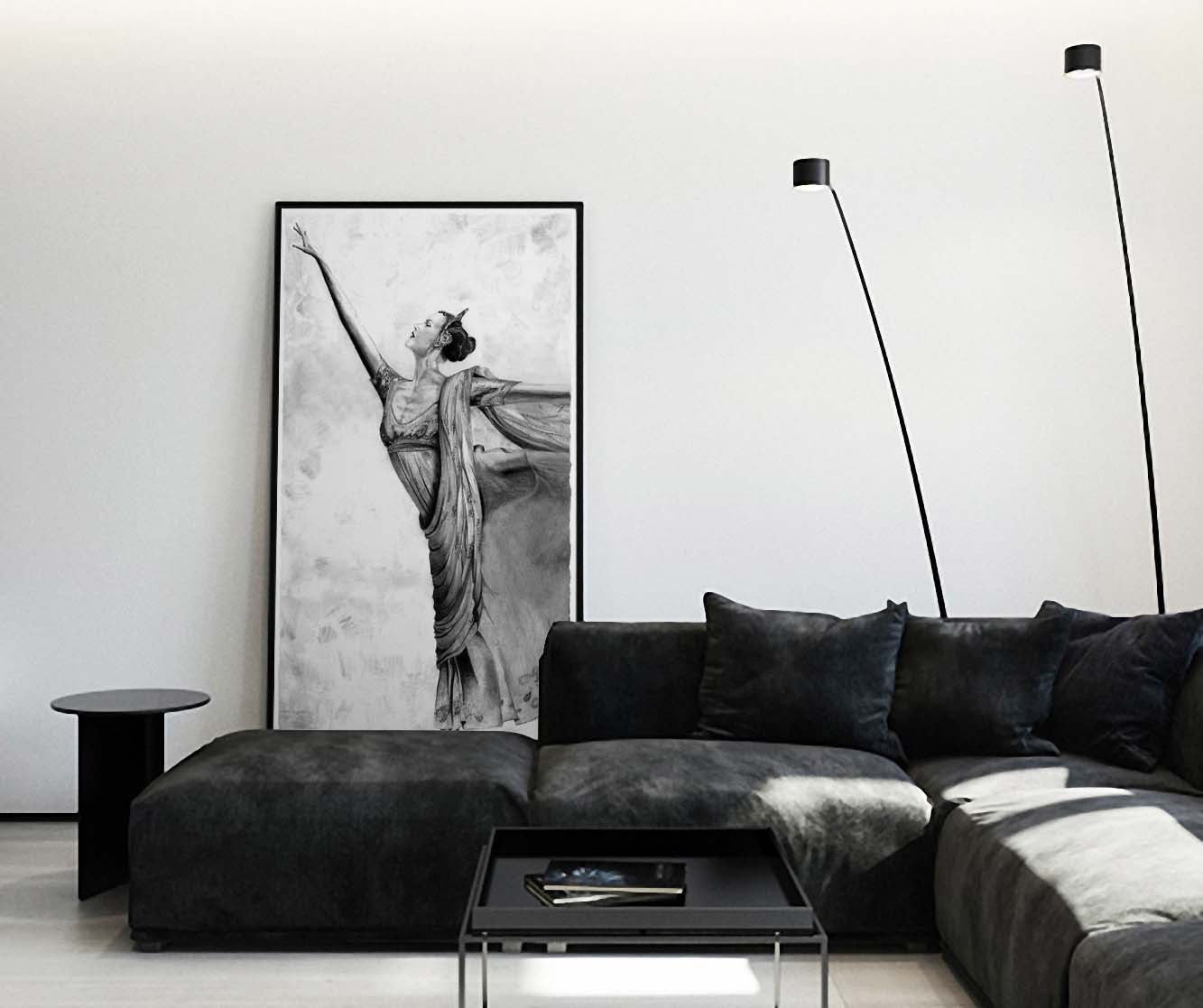 Ballerina pencil drawing by Doug LaRue leaning against wall behind a black suede leather couch