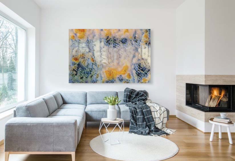 Frosted Goldfish mixed media abstract by Doug LaRue on  a living room  wall next to a fireplace