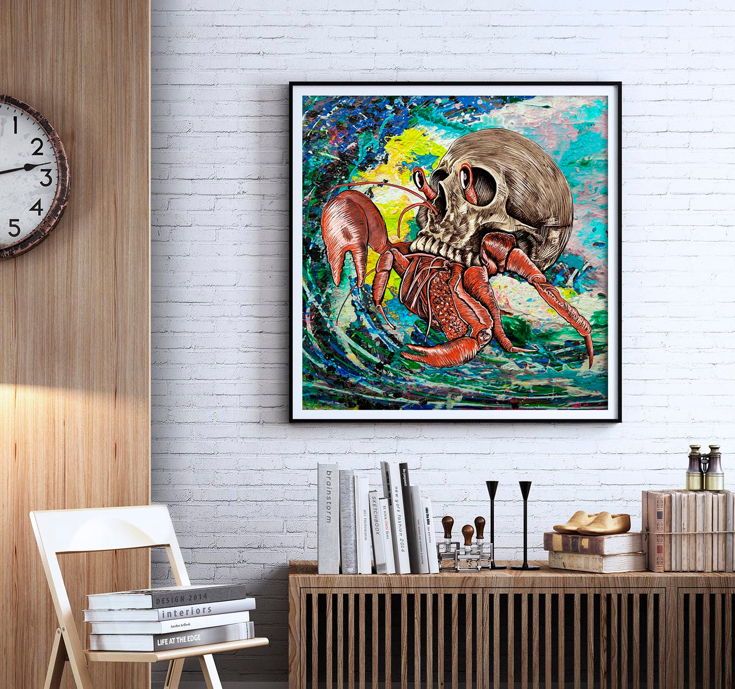 Skull Crab mixed media art by Doug LaRue framed on a white brick wall 